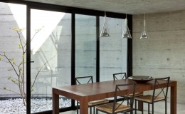 beautiful modern house in cement, interior, wooden dining table